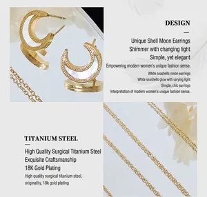 Detail of 18K gold plated titanium steel moon earrings with white shell inlay