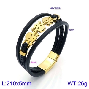 Detail showing multi-layer braided leather bracelet with golden skulls and magnetic clasp