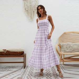 Detail of purple and white checkered maxi dress with smocked bodice and tiered hemline