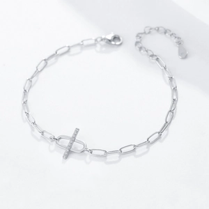 Macro shot of S925 sterling silver chain bracelet with zircon cross bar and hallmark