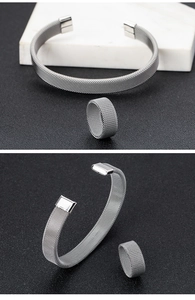 Detailed view of silver mesh woven stainless steel bracelet and matching ring set