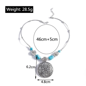 Detailed view of Bohemian mandala pendant necklace with turquoise beads and rose charms