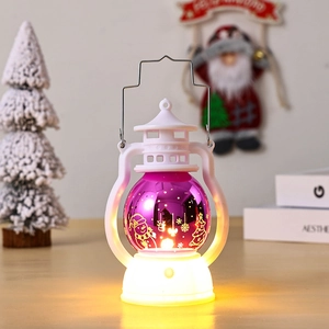 Detail view of purple laser Christmas lantern with snowman silhouette and warm LED light