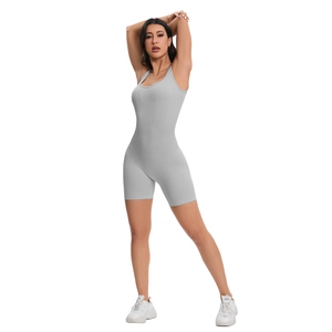 Detailed texture of grey ribbed seamless yoga jumpsuit with U-neck and bodycon fit