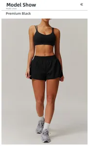 Detail of high-stretch black yoga set featuring a strapless sports bra and drawstring shorts