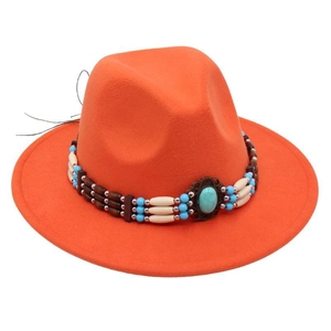 Detail of turquoise bead band on an orange wool felt fedora jazz hat with ethnic style