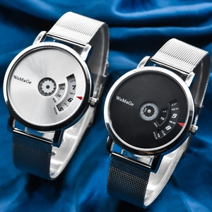 Modern spinning dial watches with silver mesh straps on blue silk fabric backdrop