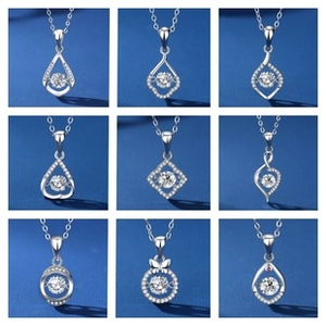 Macro display of nine silver necklace pendant styles with sparkling moissanite stones