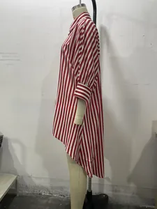 Detail of red and white vertical striped long sleeve shirt with asymmetrical high-low hem