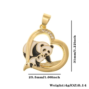 Detailed view of heart-shaped panda charm in gold with black and white enamel details
