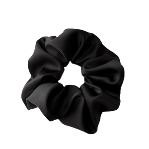 Elegant black satin scrunchie with a soft silky texture and voluminous folds on white background