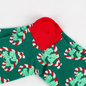 Detail of Christmas stocking featuring Jingle Bells embroidery and candy cane heart