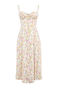 Detail of floral backless midi dress with high side slit and delicate spaghetti straps
