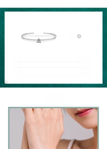 Detailed view of 925 silver open bracelet with zircon stone inlay and size information