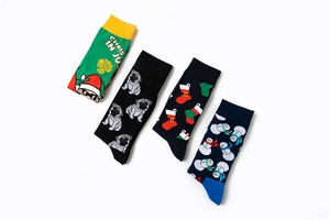 Set of four Christmas cotton socks featuring Santa, Pug, and Snowman festive patterns
