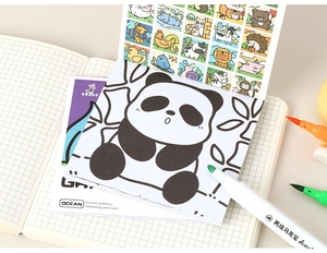Detailed view of mini watercolor coloring book with panda patterns and vibrant markers