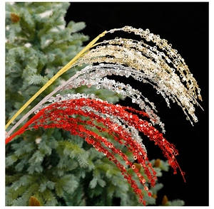Close-up of sparkling gold, red, and silver sequin branches for Christmas tree decoration