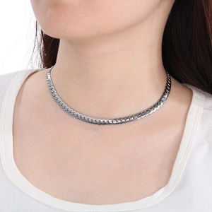 Close-up of flat Cuban snake chain necklace in silver stainless steel on model neck