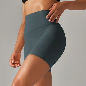 Close-up of high-waisted yoga shorts in dark grey blue with seamless matte fabric