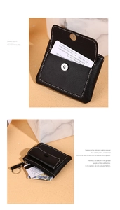 Close-up of black ultra-thin card wallet with magnetic flap and metal key ring