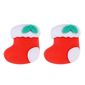 Close-up of festive red and white Christmas stocking earrings with green leaf detail