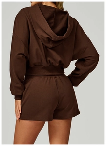 Back view of a women's dark brown cropped hoodie and high-waisted shorts set