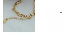 Detail of gold titanium steel double-layer chain with lobster clasp and K18 tag