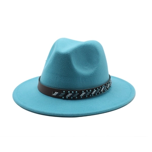 Detail of lake blue wool fedora hat with geometric beaded brown leather band
