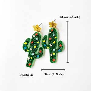 Detail of glitter green acrylic cactus earrings with size dimensions 61mm by 30mm