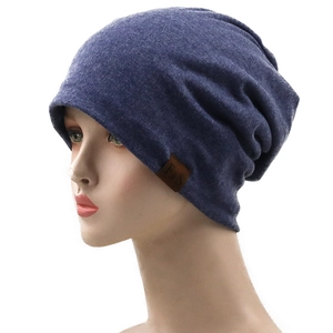 Dark blue lightweight breathable knitted slouchy beanie with a brown leather F&S logo tag