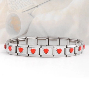 Detail shot of Italian modular stainless steel bracelet with red enamel hearts links