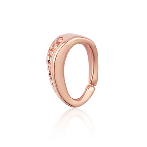 Macro shot of rose gold ear cuff with curved design and sparkling micro-paved crystals