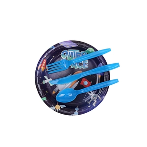 Close-up of outer space themed paper plate with blue plastic cutlery for boy's birthday