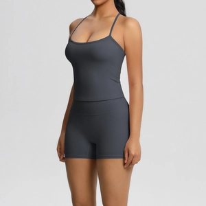 Detail of dark grey yoga set featuring a strapless tank top and high-waisted gym shorts