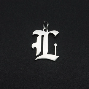Detailed close-up of a silver Gothic letter L pendant in stainless steel with a metal ring