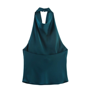 Detailed flat lay of dark green satin halter top showing silky texture and draped neckline