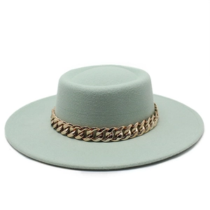 Detail of mint green wool felt flat top boater hat with a chunky gold chain strap