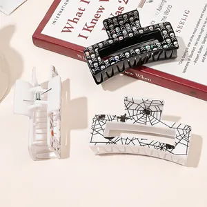 Three medium square hair claws featuring Halloween skull, spider web, and pumpkin patterns