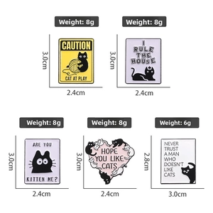 Set of five black cat enamel pins with creative phrases and detailed dimensions