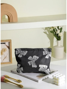 Vintage black makeup bag with white bow pattern and high capacity portable hand clutch