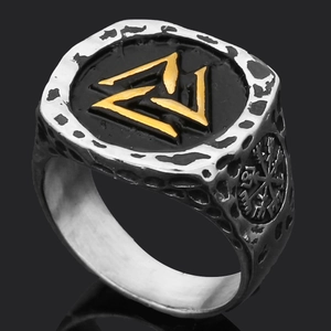 Detailed side view of vintage Viking Thor Hammer ring with Nordic rune engravings