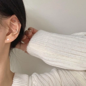 Minimalist S925 sterling silver stud earrings set with zircon stones on female model