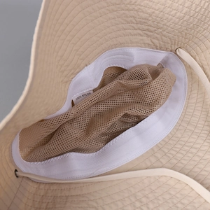 Detail of sun hat interior with breathable mesh lining and adjustable windproof strap