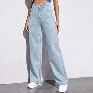 Detail of high-waisted wide-leg light blue denim jeans with classic white stitching
