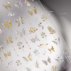 Close-up of 5D holographic silver butterfly and rose embossed nail art stickers