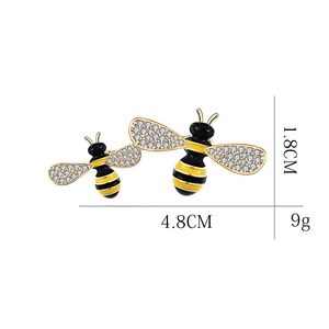 Detail view of golden honey bee brooch with dimensions 4.8cm and pave-set zircons