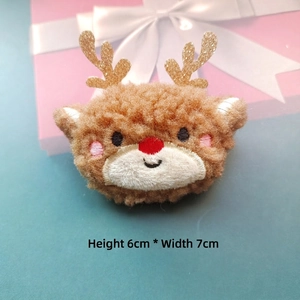 Plush Christmas reindeer accessory with gold antlers and red nose, size 6cm by 7cm