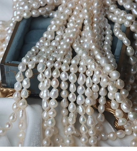 Macro shot of 6.5-7mm irregular baroque freshwater pearls with iridescent luster