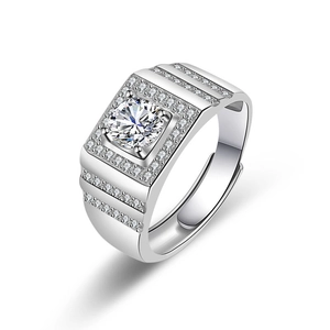 Macro view of men's wide silver ring with sparkling round cut zircon and adjustable band