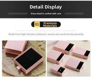 Pink drawer jewelry box with black velvet lining and silk ribbon pull for ring storage